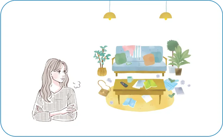 散らかっている部屋にため息をつく女性
